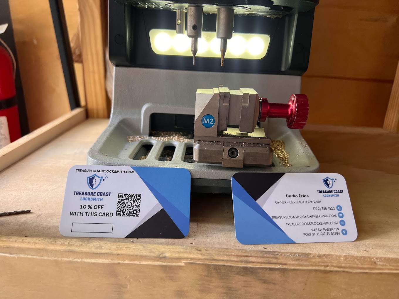 Key Cutting Machine with Business Cards - Treasure Coast Locksmith