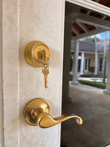 Grade 1 deadbolt being installed on a Cocoa Beach front door