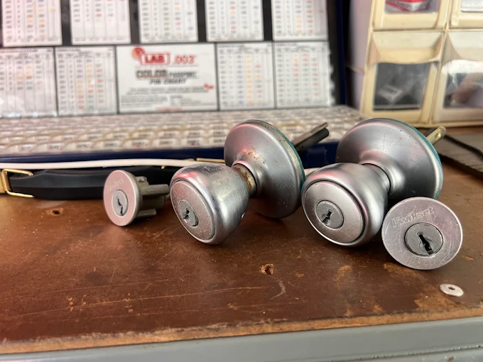 Locksmith rekeying a residential door lock cylinder in Titusville, FL